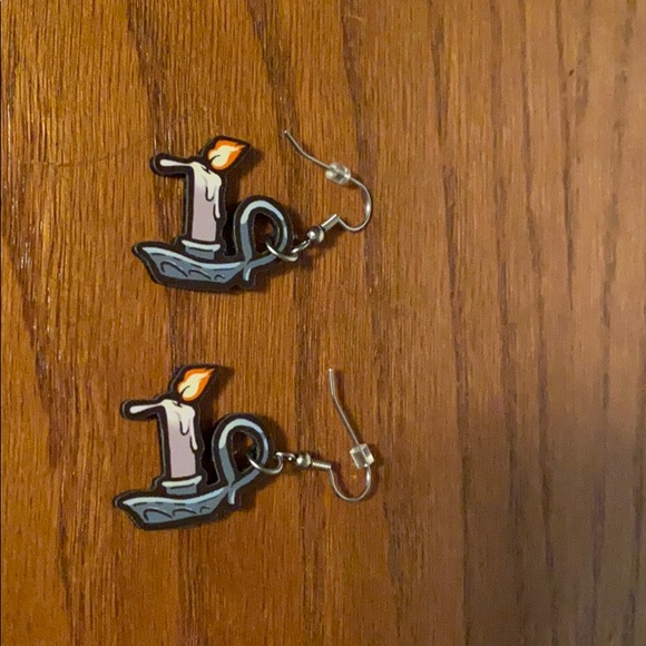 Dripping candle eccentric earrings. Creepy!